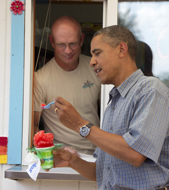 President Barack Obama enjoys a snow cone while on the campaign trail, Aug. 13, 2012, in Denison, Iowa.