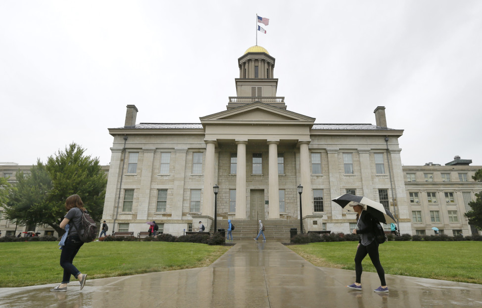  In this Oct. 2, 2014 file photo, students walk across campus at the University of Iowa in Iowa City, Iowa. (AP Photo)