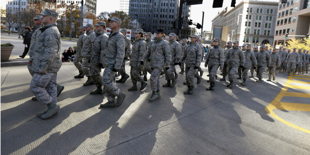 Military service veterans march in the Pittsburgh Veterans Day parade on Nov. 8, 2014, in Pittsburgh. 