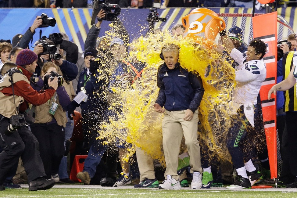 Seattle Seahawks head coach Pete Carroll is doused with Gatorade late in the second half of the NFL Super Bowl XLVIII football game  Feb. 2, 2014, in East Rutherford, New Jersey, once it was apparent his team was about to win the championship game. (AP Photo) 