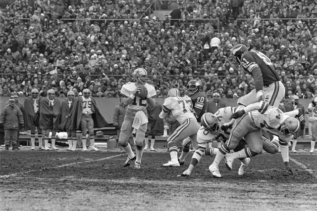 Dallas Cowboys quarterback Roger Staubach (12), seen here in the December 1975, says he recited a prayer before throwing the game winning touchdown. (AP)