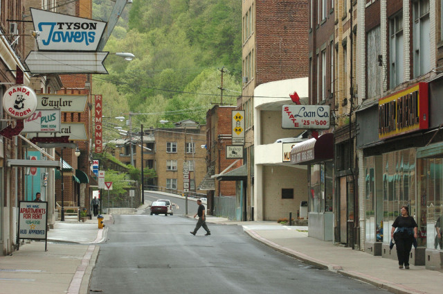 (File) People walk down McDowell Street in Welch, West Virginia. (AP Photo) 