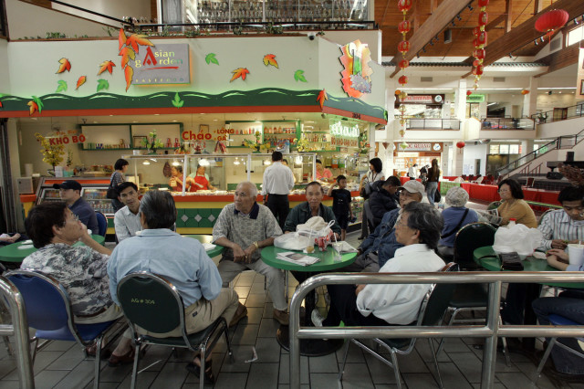 FILE -- People gather at the Asian Garden mall in little Saigon in Westminster, In Orange County, California. (AP Photo) 