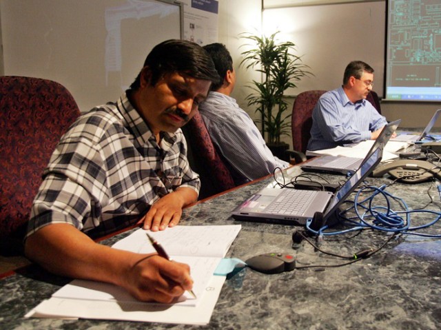 FILE – Silicon Valley engineers including, from left to right, Vallab Kulkarni, and Sudhakara Ram conduct a meeting in Santa Clara, California. Almost one-third of Indian Americans work in science and engineering fields. (AP Photo)