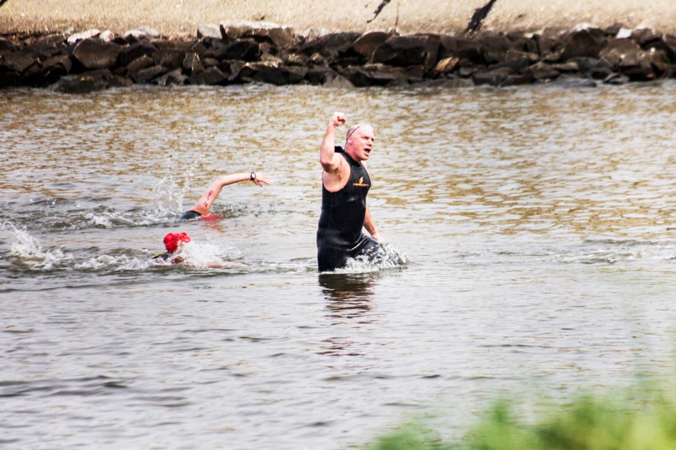 The author is triumphant after finishing the Chesapeake Bay swim challenge in 2013. (Photo by Andrew Weeks)