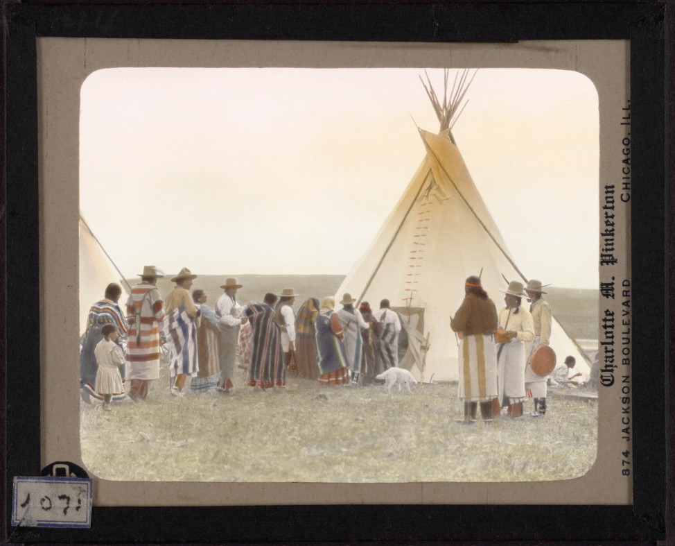 White Grass entering his tipi at the end of the ceremony of the Dancing Pipe, from  the lecture, "Dances of the Blackfoot" given in 1936.  Hand-painted lantern slide by photographer Walter McClintock (1870-1949) of the Blackfoot Indians of Montana. (Yale Collection of Western Americana, Beinecke Rare Book and Manuscript Library)