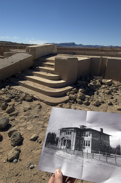 The foundation of the St. Thomas Schoolhouse, which once looked like the black and white photo, sat underwater for many years after Lake Mead filled. Due to declining water levels, the town resurfaced in 2002. (Photo: Lake Mead NRA Public Affairs via Flickr) 