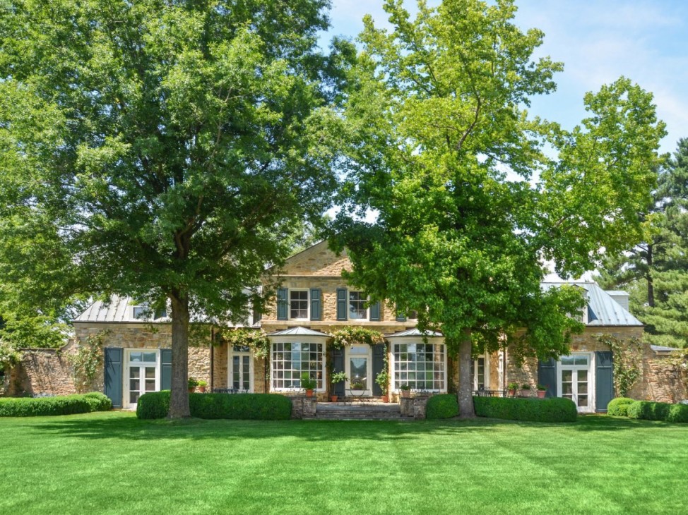 Virginia's "Oakendale Farm" features two stone guest cottages, a greenhouse, pool, pool house, stables and a  log cabin on the property. (Courtesy Redfin) 