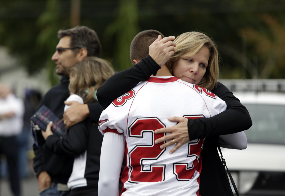 Students and family members reunite at Shoultes Gospel Hall after a student opened fire at Marysville-Pilchuck High School, in Marysville, Washington October 24, 2014. (Reuters)