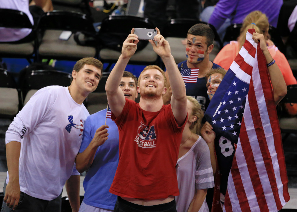 Americans take a group selfie before a volleyball match between the United State and Italy, July 23, 2015. (AP Photo)