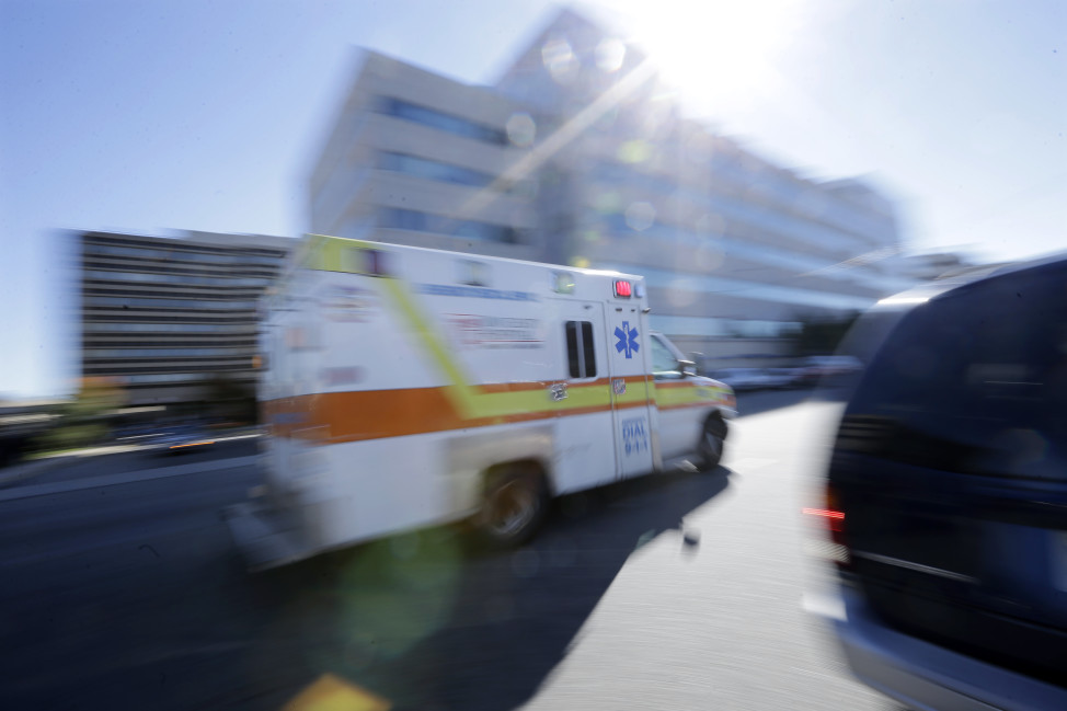 An ambulance drives near  University Hospital of Newark in Newark, New Jersey. (AP Photo)