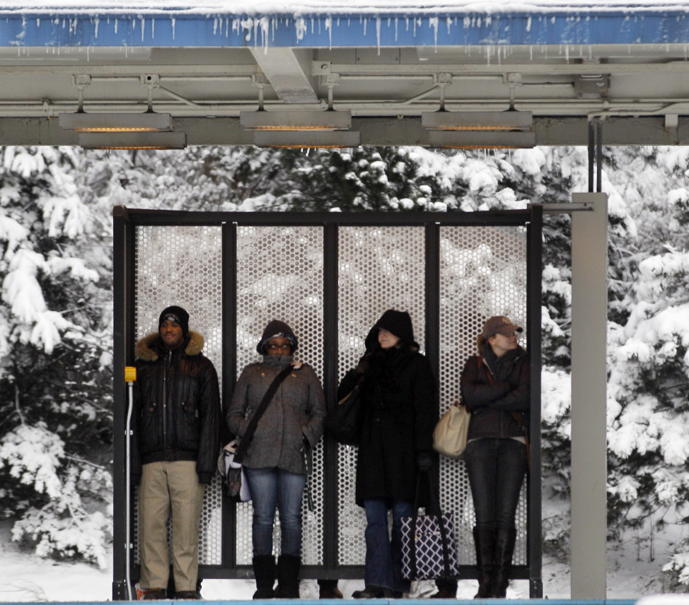 In this file photo, pedestrians wait for a CTA train at Blue Line in Chicago, Illinois. (AP Photo) 