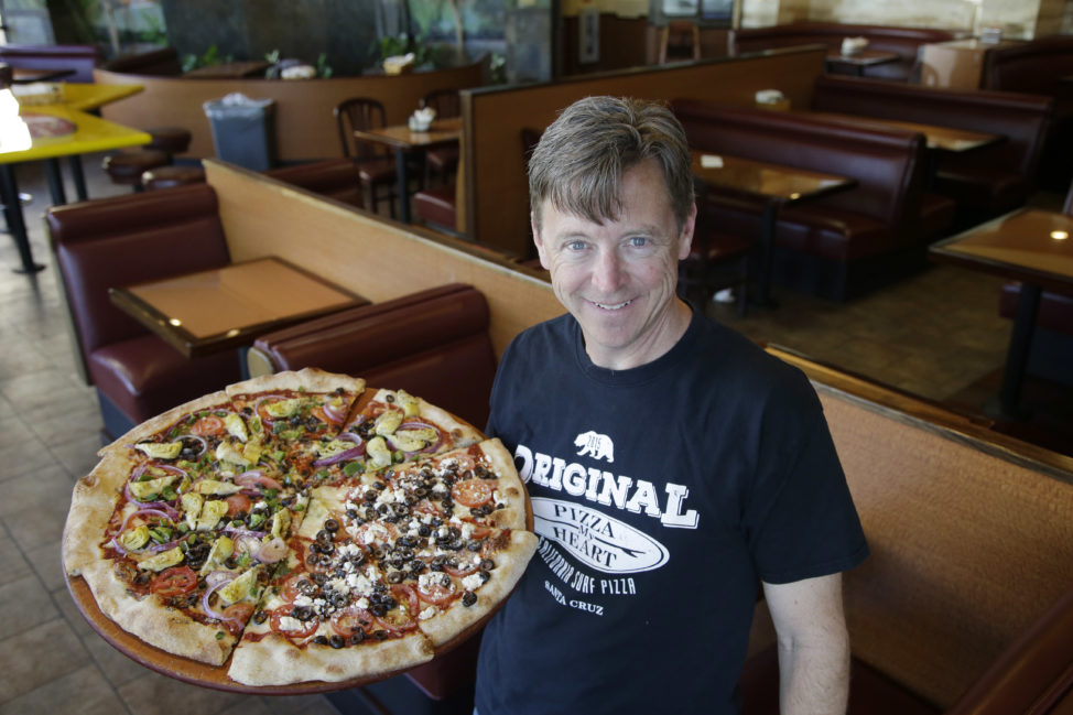Chuck Hammers, owner of Pizza My Heart, in one of his shops in San Jose, California on March 28, 2016. (AP Photo)