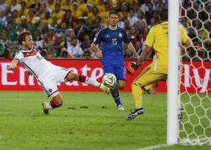 Germany's Goetze shoots to score a goal past Argentina's goalkeeper Romero during extra time in their 2014 World Cup final at the Maracana stadium in Rio de Janeiro