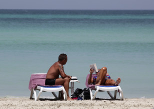 Tourists lie on beach at a five-star all-inclusive resort in Varadero