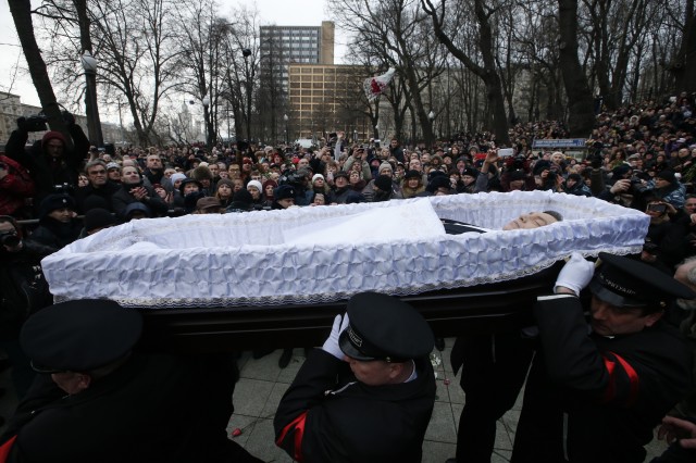 Pallbearers carry coffin with body of Russian leading opposition figure Nemtsov during memorial service in Moscow