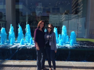 My mom and I pose in front of one of the many blue fountains.