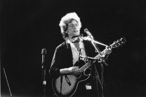 Bob Dylan & his acoustic guitar--date unknown. The 72-year old was awarded France's highest cultural honor November 13th in Paris. (AP Photo)