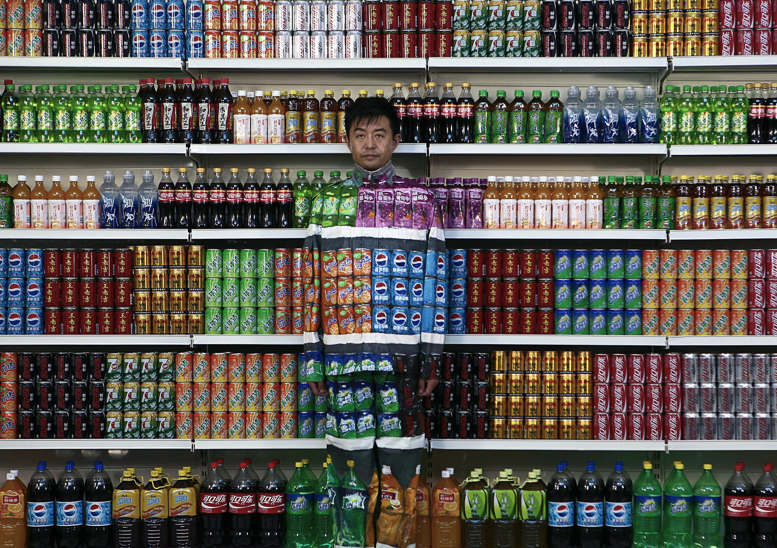 Chinese artist Liu Bolin, waits for his colleagues to put finishing