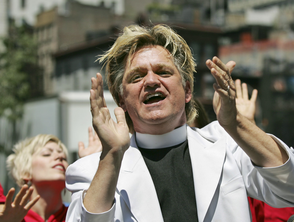 Bill Talen, also known as "Reverend Billy," sings with the Stop Shopping Gospel Choir  in Union Square in New York, Monday, July 2, 2007, to protest his arrest there Friday night while reciting the First Amendment. (AP Photo/Kathy Willens)