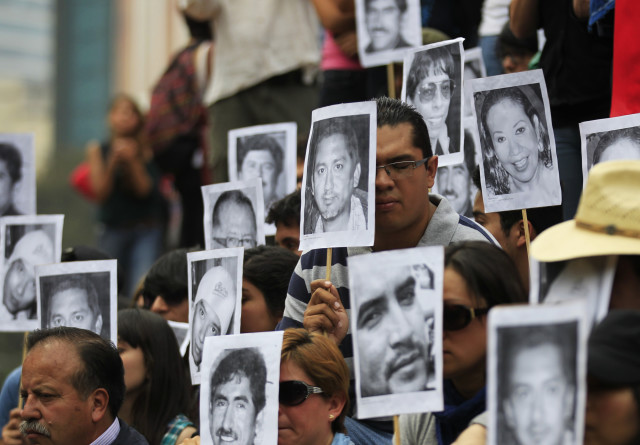 Journalists hold photographs of colleagues who have been killed in the last years while covering the news in Mexico, in Mexico City February 23, 2014. Journalists took to the streets several weeks after Gregorio Jimenez de la Cruz, a reporter for the Veracruz state newspaper Notisur y Liberal del Sur, was kidnapped and found buried along with two people. The Committee to Protect Journalists called on Mexican authorities to conduct a thorough investigation into the murder of Jimenez de la Cruz according to a press release. Jimenez de la Cruz was the second journalist to be killed in 2014, according to local media. REUTERS/Henry Romero