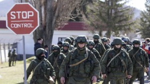 Russian soldiers on the march in Crimea. Stop signs only work if there is credible fear of a fine. Photo: Reuters/Baz Ratner