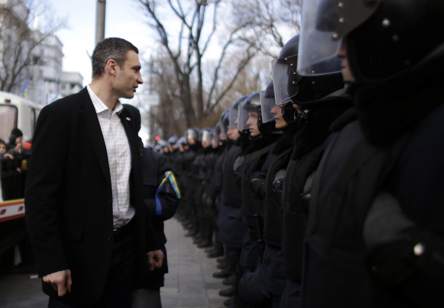 Klitschko walks past police outside parliament in Kiev