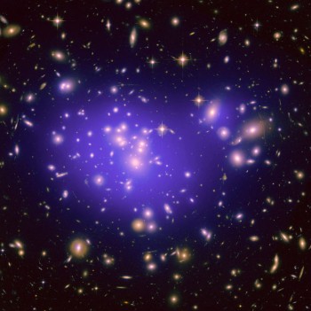 From Hubble - Abell 1689, an immense cluster of galaxies located 2.2 billion light-years away. Dark matter cannot be photographed, but its distribution is shown in the blue overlay (ASA/ESA/JPL-Caltech/Yale/CNRS)