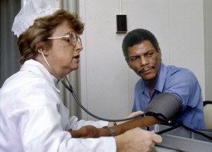 Patient having blood pressure measured (Photo: National Cancer Institute/Linda Bartlett)