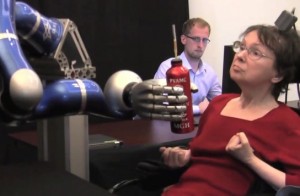 In a clinical trial, a woman used the BrainGate system to mentally control a robotic arm and reach for a drink.  (Photo: The BrainGate Collaboration)