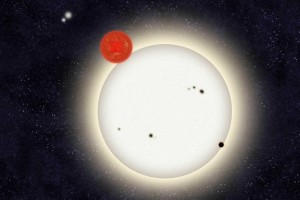 The newly discovered planet PH1 is depicted in this artist’s rendition transiting the larger of the its two host stars. Left of the planet, off in the distance, is a second pair of stars that orbit PH1. (Image: Haven Giguere/Yale)