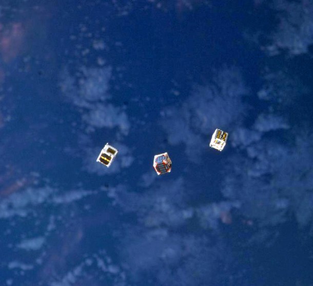 No, these aren't miniature UFOs but are tiny cube shaped satellites that were released into space from the airlock of the International Space Station's Kibo laboratory. One of these little CubeSats was developed by a group of student interns from San Jose State University and will be used for a communications experiment (Photo: NASA)