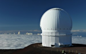 The dome of the Canada-France-Hawaii Telescope (CFHT) is a world class 3.6-meter telescope that sits above the clouds atop Hawaii's Mauna Kea, a dormant volcano. (Photo: © J.-C. Cuillandre (CFHT))