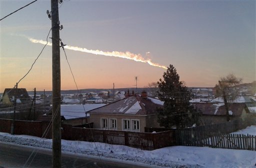 A meteorite contrail is seen over a village of Bolshoe Sidelnikovo 50 km of Chelyabinsk on Friday, Feb. 15, 2013. (Photo: AP/Nadezhda Luchinina, E1.ru)