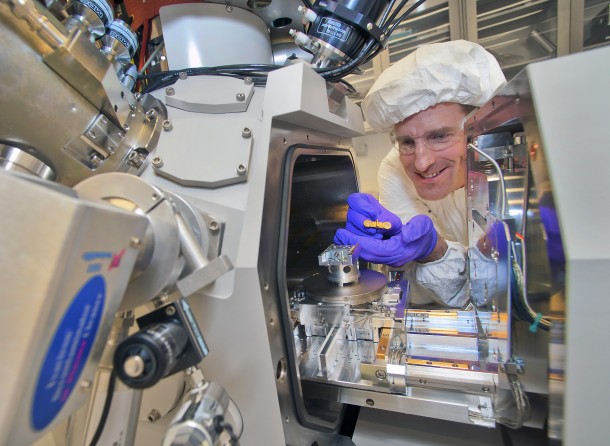 Engineer uses a focused-ion beam instrument to prepare samples of organic solar cell material for imaging under an electron microscope. (Brookhaven National Laboratory)