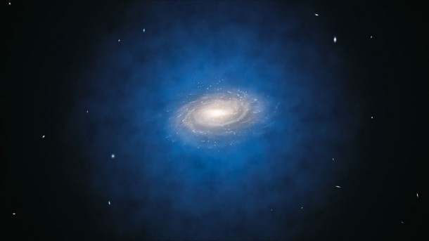 An artist's impression shows the Milky Way galaxy. The blue halo of material surrounding the galaxy indicates the expected distribution of the mysterious dark matter. (ESO/Calçada)