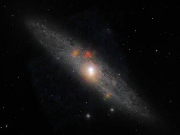 The Sculptor galaxy located in the constellation Sculptor is seen here in a new composite image from NASA's Nuclear Spectroscopic Telescope Array (NuSTAR) and the European Southern Observatory in Chile. (NASA/JPL-Caltech/JHU)