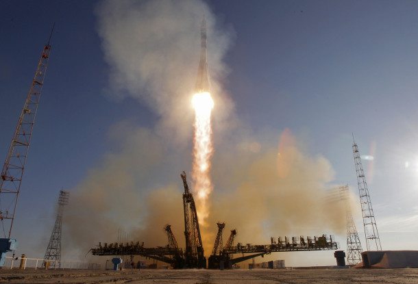 A Soyuz spacecraft carrying three new crewmembers for the International Space Station along with the Olympic Flame for the Sochi 2014 Winter Games blasts off from the Baikonur cosmodrome, in Kazakhstan on Thursday, Nov. 7, 2013. (AP/Dimitry Lovetsky)