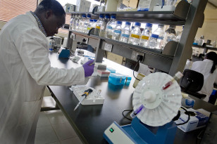 A scientist works in a laboratory at the International Livestock Research Institute in Nairobi, Kenya.  (Australia Dept of Foreign Affairs & Trade/Creative Commons)