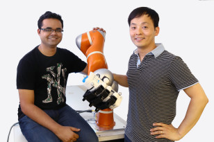 Scientists Ashwini Shukla (left) and Seungsu Kim (right) are members of the LASA team that helped develop the new dexterous robotic arm (center) - ((c) EPFL)