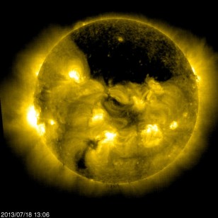 The ESA/NASA Solar and Heliospheric Observatory (SOHO) captured this image of a gigantic coronal hole hovering over the sun’s north pole on July 18, 2013. (ESA, NASA/SOHO)