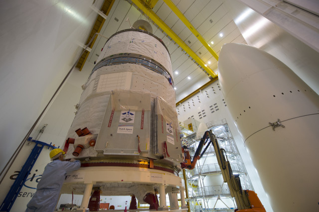 A technician is shown making adjustments on an ESA ATV-5 spacecraft that was being prepared for integration on an Ariane 5 rocket on 24 June 2014.  This is ESA’s fifth and final Automated Transfer Vehicle (ATV) and was named for the father of the “Big Bang”, Georges Lemaître, a Belgian physicist.  The spacecraft, which will deliver more than 2600 kg of goods to the International Space Station, is scheduled for launch sometime in the second half of July, 2014 from the Spaceport in Kourou, French Guiana. (© ESA-S. Corvaja)