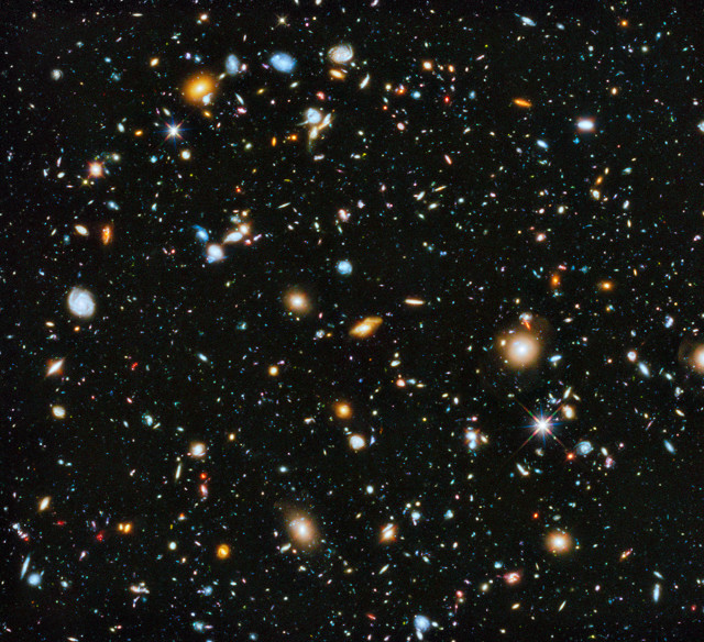 Astronomers gathered a number of images that were taken with NASA's Hubble Space Telescope and put together a spectacular and colorful picture of the evolving universe. June 3, 2014. (NASA/ESA)