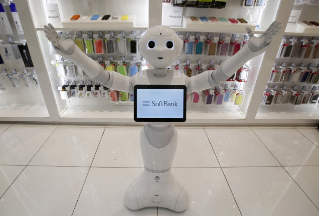 This is “Pepper” a human-like robot made by Japan’s SoftBank Corporation.  Pepper was displayed at SoftBank’s Tokyo branch on June 6, 2014.  SoftBank announced that it will begin selling robots like Pepper for personal use by next February. (Reuters)