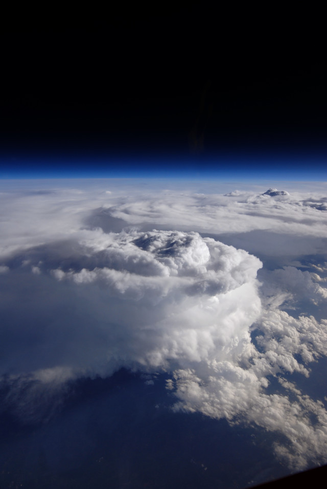 This is what a storm cell looks like from high above the clouds.  The photo was taken by a high-altitude NASA ER-2 aircraft as a part of a joint project between the space agency, NOAA and Duke University called the Integrated Precipitation and Hydrology Experiment (IPHEx).  The IPHEx program, which studied precipitation over mountainous terrain along the U.S. East Coast, came to an end on June 16, 2014.  (NASA)