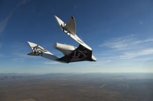 SpaceShipTwo, christened VSS Enterprise during a glide flight in Mojave, CA, USA. Mark Greenberg/Virgin Galactic)