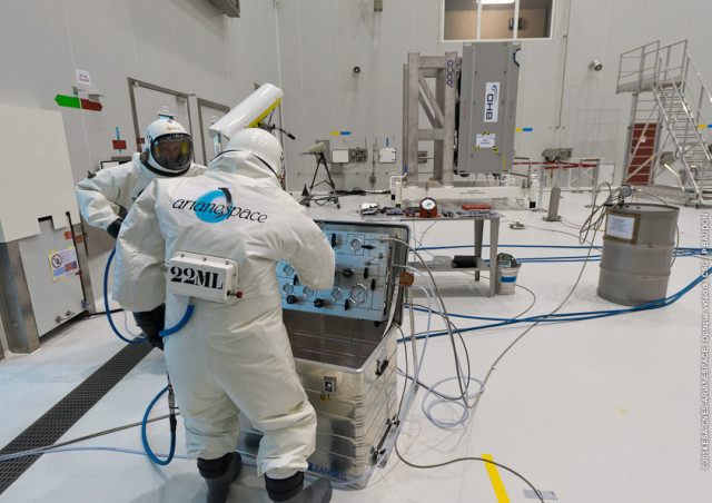 Technicians at Europe's Spaceport in Kourou, French Guiana are shown in this photo released on August 8, 2014 as they fuel a Galileo FOC spacecraft. The European Space Agency says that two Galileo FOC spacecraft are scheduled to be launched aboard the Arianespace Flight VS09 on August 21, 2014. (ESA)
