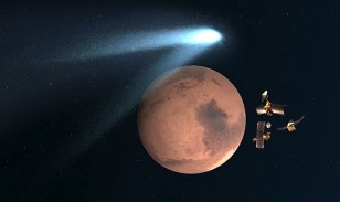 Artist's concept shows the NASA Mars orbiters lining up behind Mars for their “duck and cover” maneuver to shield them from comet dust that may result from the close flyby of Comet 2013 A1 Siding Spring  on Oct. 19, 2014.  (NASA/JPL/Caltech)