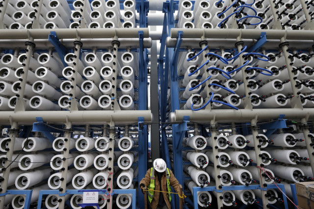 This 3/11/15 file photo shows an array of some of the 2,000 pressure vessels used to convert seawater into fresh water in the Carlsbad Desalination Project’s plant, Carlsbad, Calif.  Considered to be the largest desalination facility in the western hemisphere, it is scheduled to start operations some time later this year and is expected to provide 50 million gallons of fresh drinking water a day.  (AP)