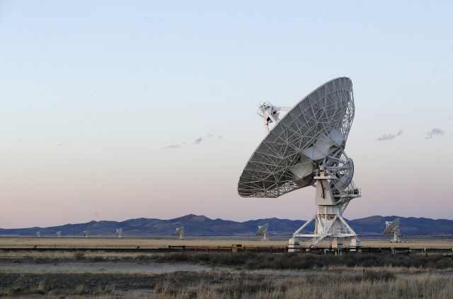 Sunset falls over antennae at the National Radio Astronomy Observatory's Very Large Array, on 3/3/15.  The radio astronomy antenna array is located in Socorro County, New Mexico. (AP)